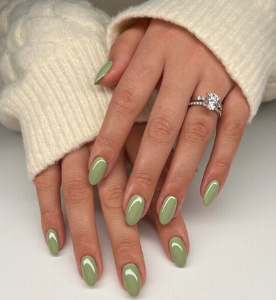 hands wearing 1001 Sage Groovin' Gel Polish by DND