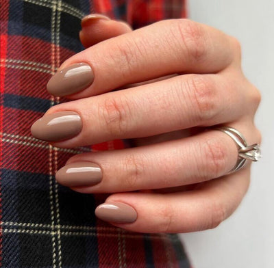 hands wearing 418 Butternut Squash Gel Polish by DND