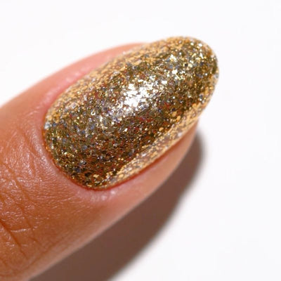 finger wearing DND Gel Polish - 911 Golden Aura