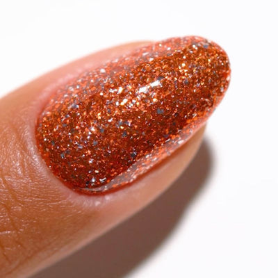 finger wearing DND Gel Polish - 929 Orange Aura
