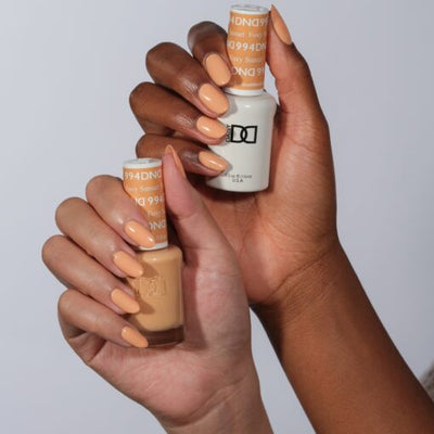 Hands wearing 994 Foxy Sunset Gel & Polish Duo by DND