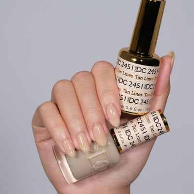hands wearing 2451 Tan Lines Gel & Polish Duo by DND DC