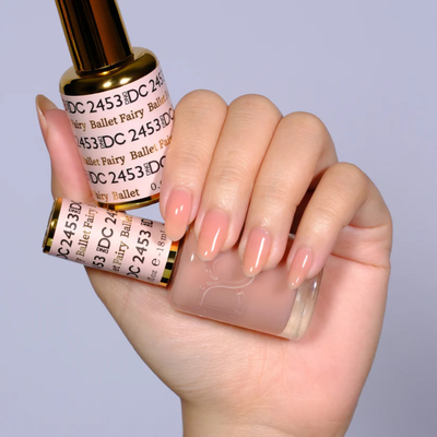 Hands wearing DND DC Gel 2453 Ballet Fairy
