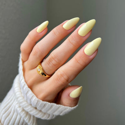 hands wearing color swatch for DND Diva 082 Sunny Delight