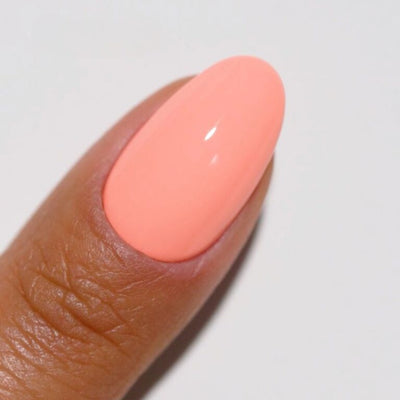 hands wearing 144 Zesty Sunrise Diva Gel & Polish Duo by DND