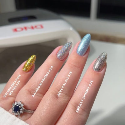 hands wearing 29 Golden Treasure Waves Gel & Polish Diva Duo by DND