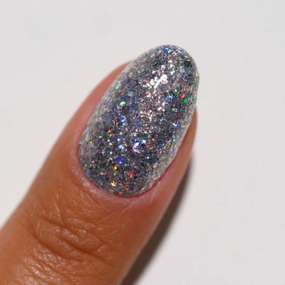 hands wearing 25 Chunky Holo Gel & Polish Diva Duo by DND