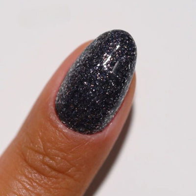 hands wearing 27 Bulletproof Gel & Polish Diva Duo by DND