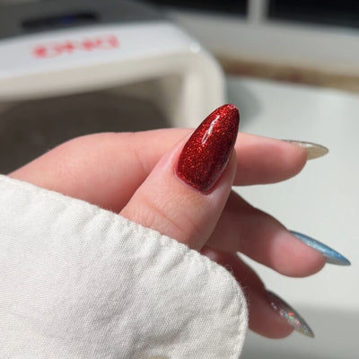 hands wearing 35 Sip N Glitz Gel & Polish Diva Duo by DND