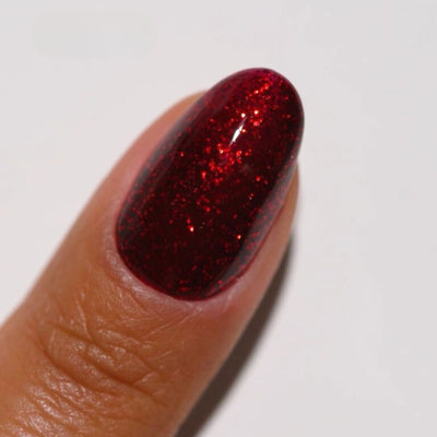hands wearing 36 Sultry Gem Gel & Polish Diva Duo by DND