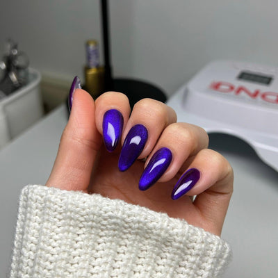 hands wearing DND Diva Puma Purple 9D Cat Eye