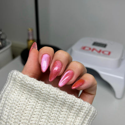 hands wearing DND Diva Lollipop Pounce Candy 9D Cat Eye