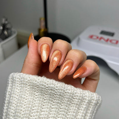 hands wearing DND Diva 'Button Nose' Candy 9D Cat Eye