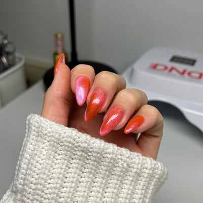 hands wearing DND Diva Jelly Belly Rubs Candy 9D Cat Eye