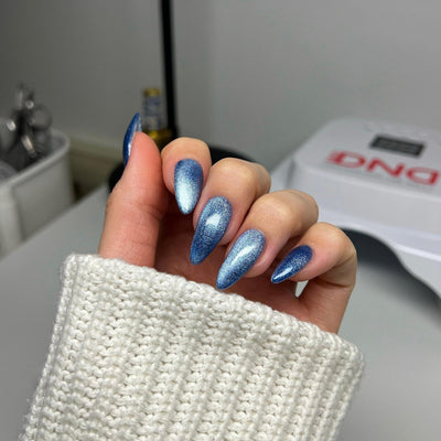 hands wearing DND Diva 'Catnip Craze' Candy 9D Cat Eye