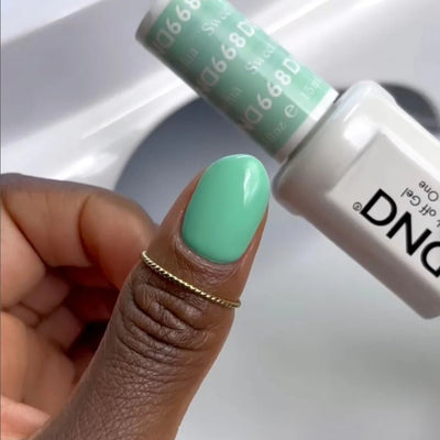 hands wearing DND Duo gel polish 668 Sweet Pistachia