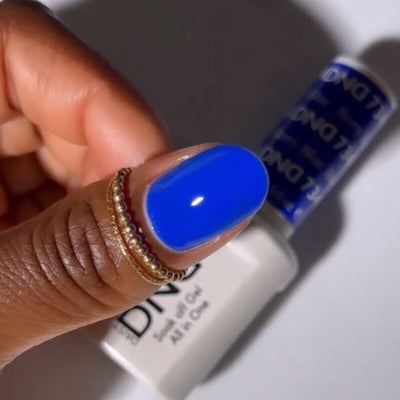 finger wearing DND Gel Polish 734 Berry Blue