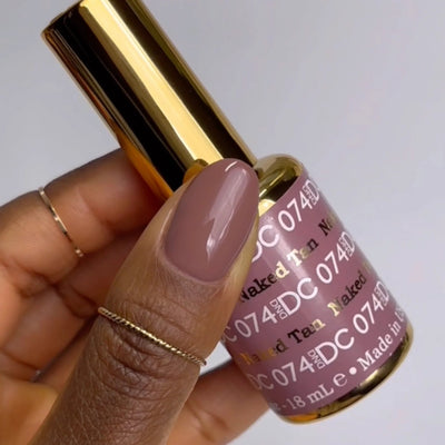 finger wearing DND DC Gel - 074 Naked Tan