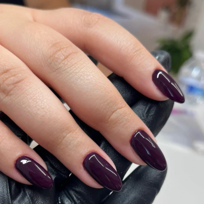 Hands wearing DND Gel 428 Rosewood