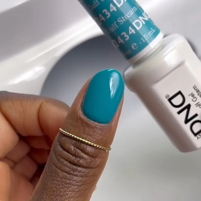 Hands wearing DND Gel 434 Gulf Stream