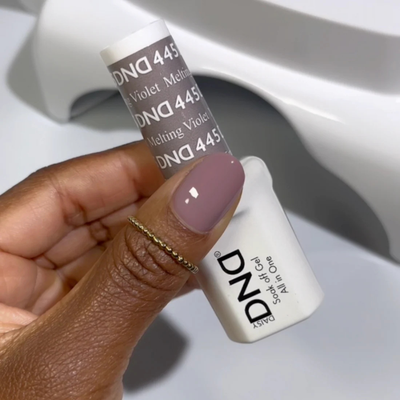 Hands wearing DND Gel 445 Melting Violet