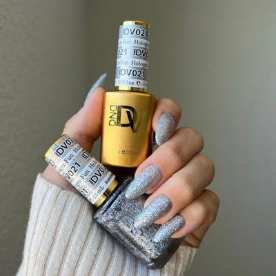 hands wearing 21 Hologra-Fun Gel & Polish Diva Duo by DND