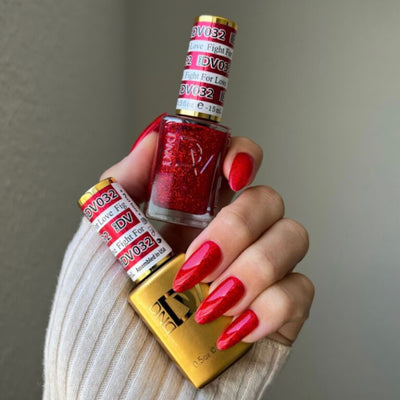 hands wearing Fight For Love Gel & Polish Diva Duo by DND