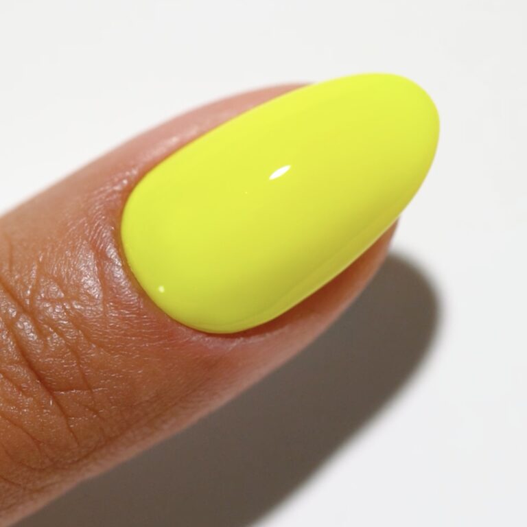 hands wearing 188 Highlighter Yellow Gel & Polish Diva Duo by DND