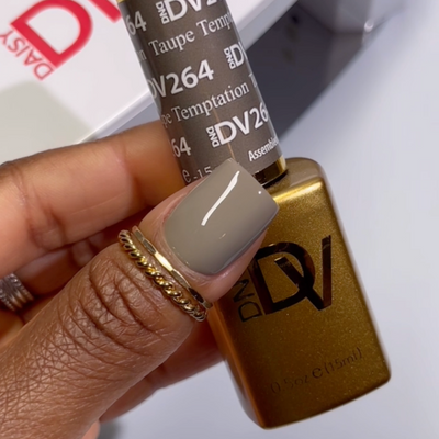 Finger wearing Taupe Temptation 264 Diva Gel & Polish Duo by DND