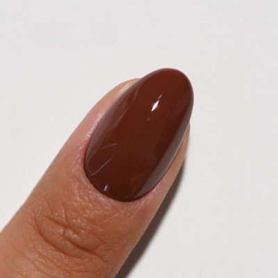finger wearing Triple Espresso 270 Diva Gel & Polish Duo by DND