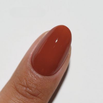 finger wearing Western Cedar 271 Diva Gel & Polish Duo by DND