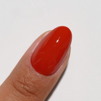 finger wearing Autumn Blaze 272 Diva Gel & Polish Duo by DND