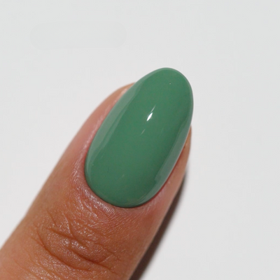 finger wearing Sage'd The Day 285 Diva Gel & Polish Duo by DND