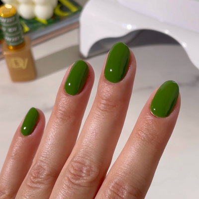 hands wearing Houseplane 287 Diva Gel & Polish Duo by DND