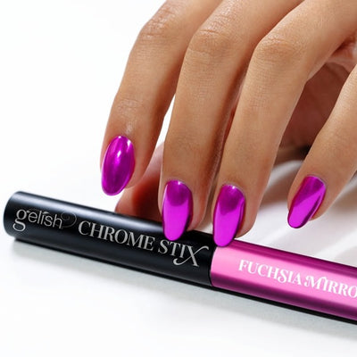 Hands wearing Fuchsia Mirror Chrome Stix by Gelish
