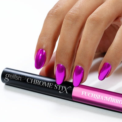Hands wearing Fuchsia Mirror Chrome Stix by Gelish