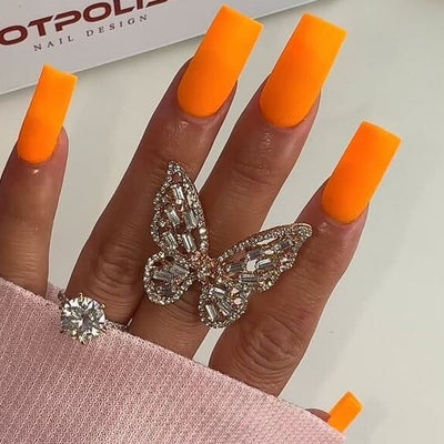 hands wearing #223 Orange U Cute OG Powder by Notpolish