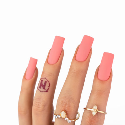 hands wearing M087 Coral Pink Matching Trio by Notpolish