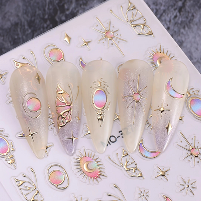 Decorative nail art stickers with celestial designs on a white surface.