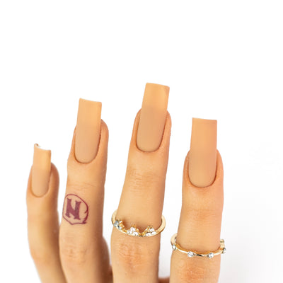 hands wearing OG217 Peanut Butter Mousse Trio by Notpolish