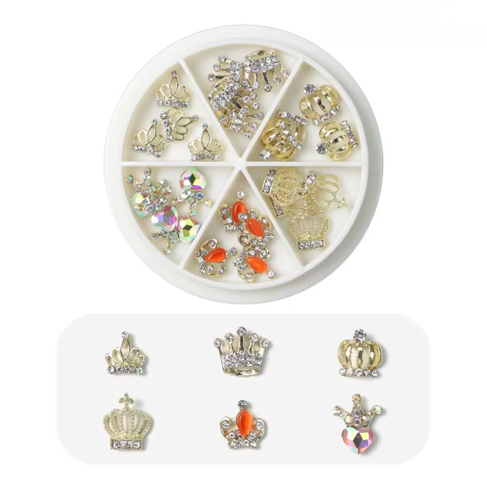 Royal Gold Princess nail charm wheel with gold crown, rhinestone, iridescent heart, and orange gemstone nail art charms for luxury manicures.