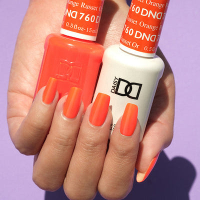 hands wearing DND Gel Polish - 760 Russet Orange