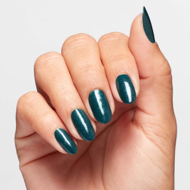 Hands wearing Q04 Let's Scrooge Polish by OPI