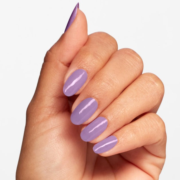 Hands wearing Q12 Sickeningly Sweet Polish by OPI