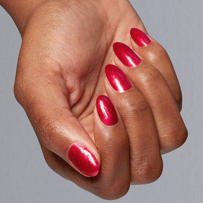 Hands wearing H025 Kiss My Aries Gel Polish by OPI