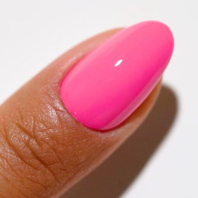 Finger wearing 2541 Topless Tropics Gel & Polish Duo by DND DC