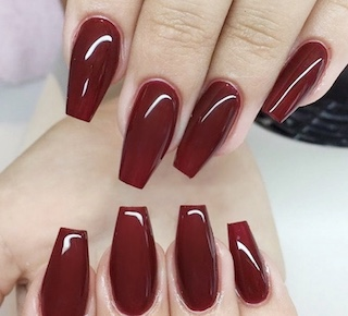 hands wearing 633 Garnet Red Trio by DND