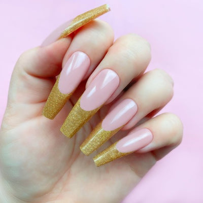 Hands wearing 112 Gold Exhibit Gel Art by Kiara Sky