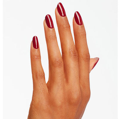 hands wearing L87 Malaga Wine Dip Powder 1.5oz by OPI