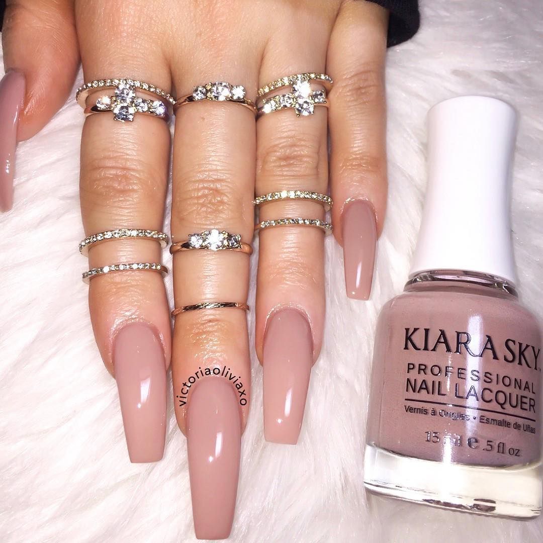 Hands wearing 605 Bare Skin Polish by Kiara Sky